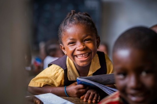 A Liberian child sitting in class gaining an education. 