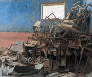 A classroom destroyed by conflict