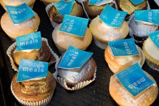 An image of cupcakes with Mary's Meals stickers on them. 