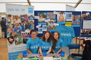 Student volunteers at a stall at a University event. 