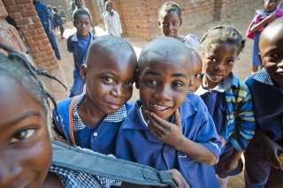 Image of children posing in front of the camera. 